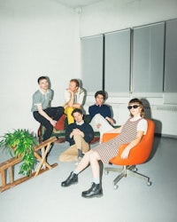 a group of people posing in a room
